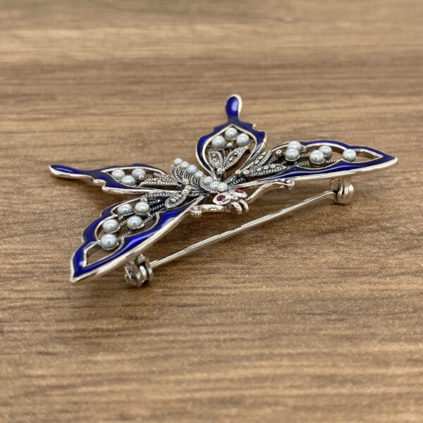 Silver butterfly brooch with pearls and enamel.