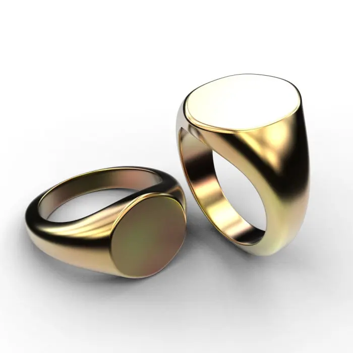 Two gold signet rings on a white background.