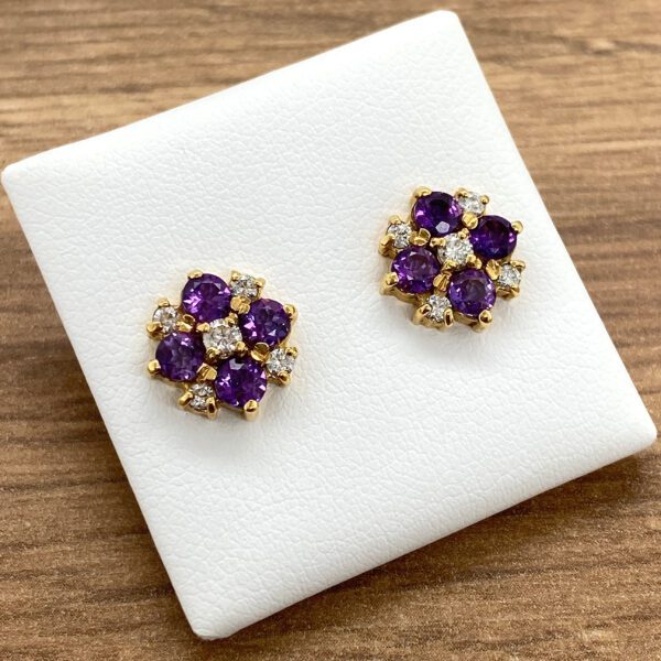 Amethyst and diamond flower stud earrings.