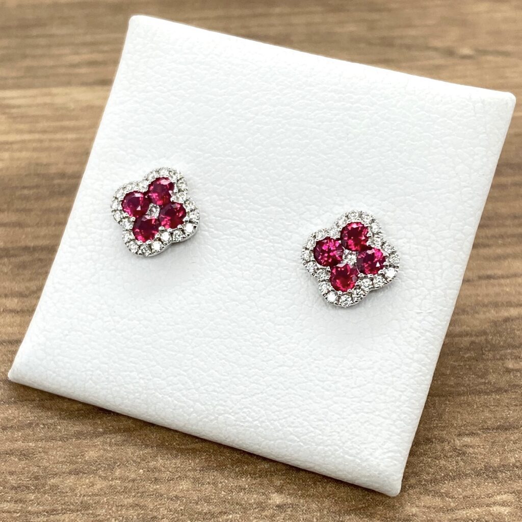 Ruby and diamond flower stud earrings.