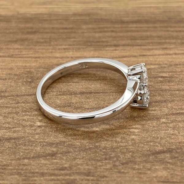 White gold ring with diamond cluster.