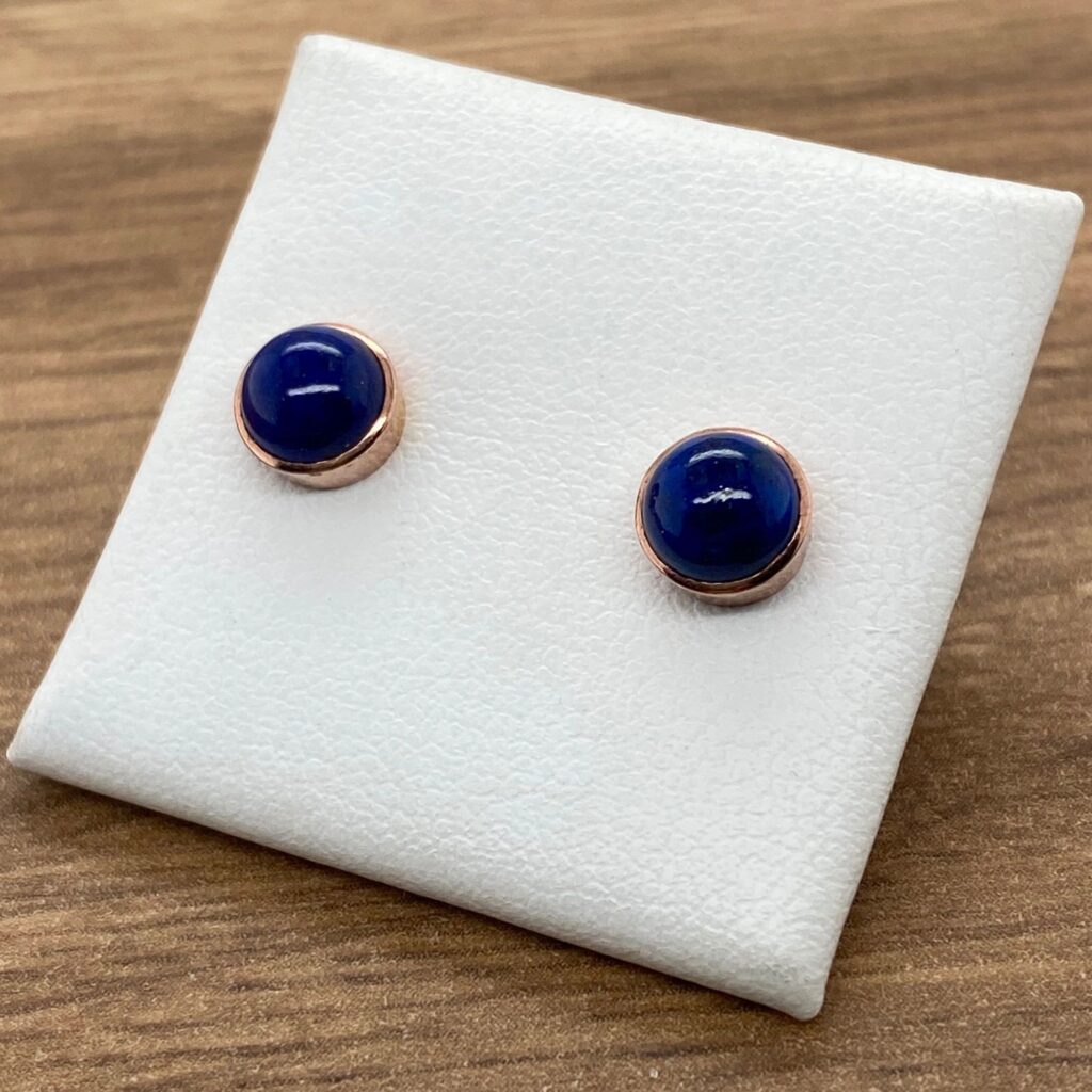 Pair of rose gold lapis lazuli earrings.