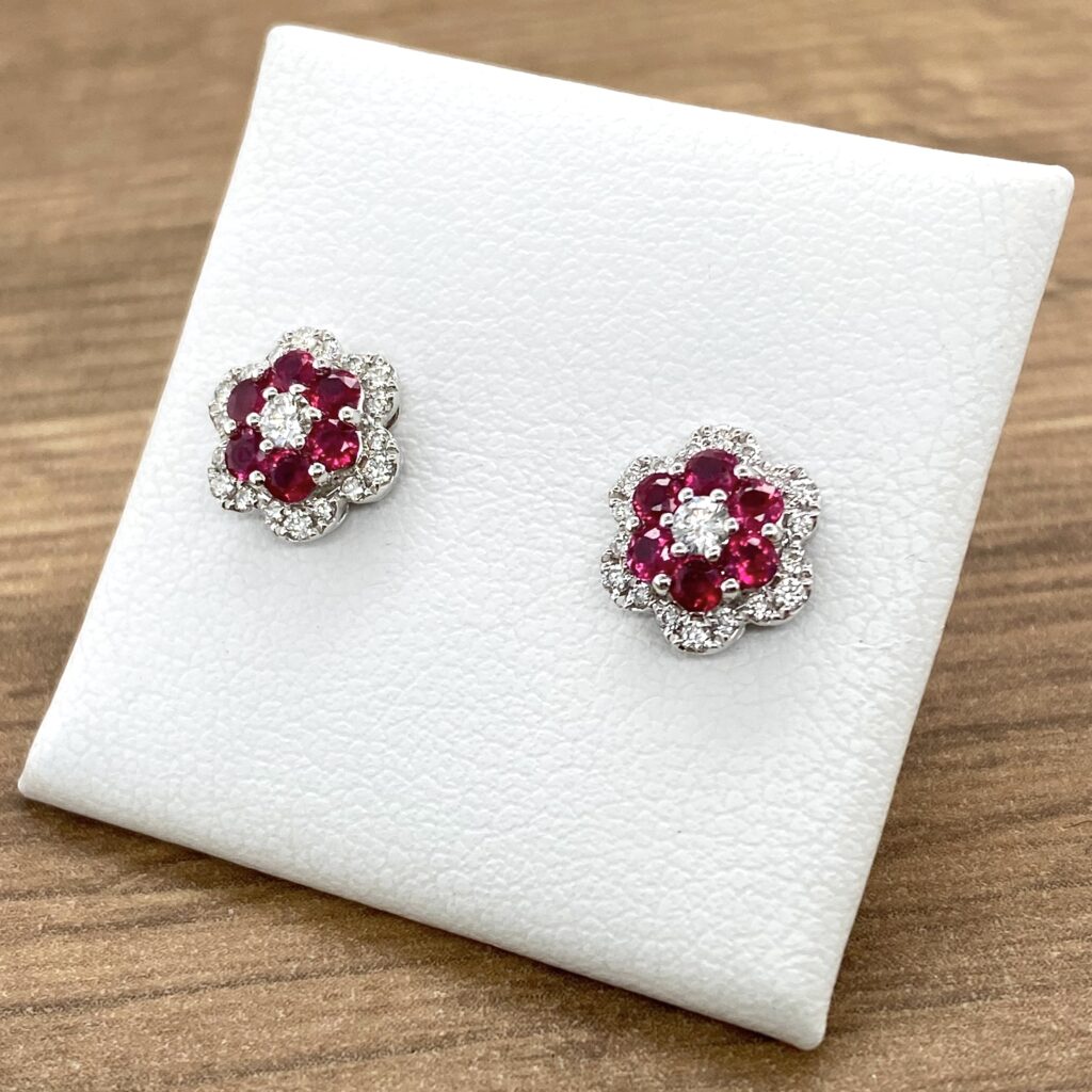 Ruby and diamond flower stud earrings.