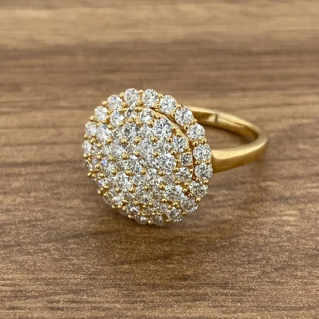 Gold ring with oval diamond setting.