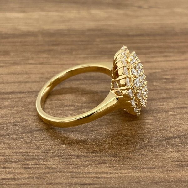 Gold ring with large diamond cluster.