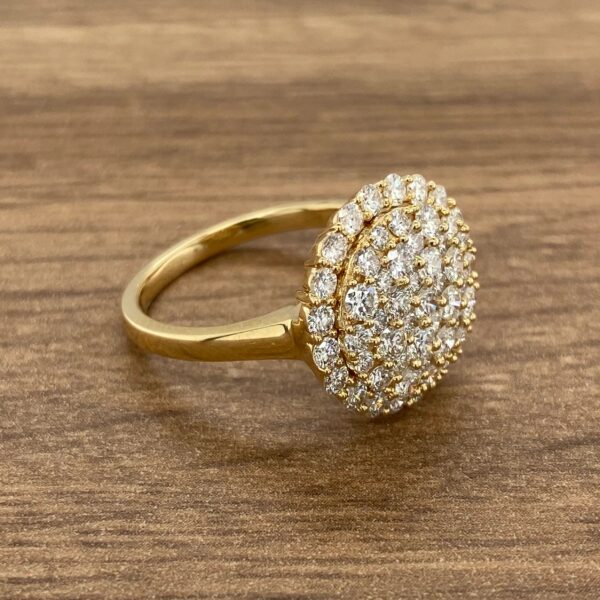 Gold ring with a large round diamond setting.