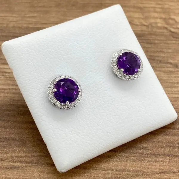 Amethyst and diamond halo earrings.