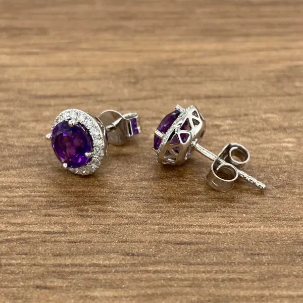 Amethyst and diamond halo stud earrings.