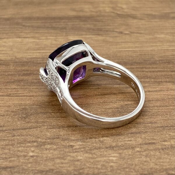 Amethyst ring with diamond accents.