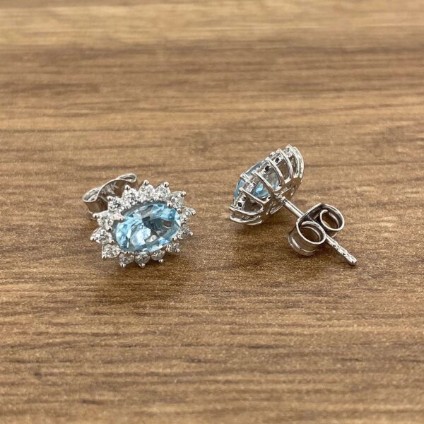 Pair of blue topaz earrings with diamonds.