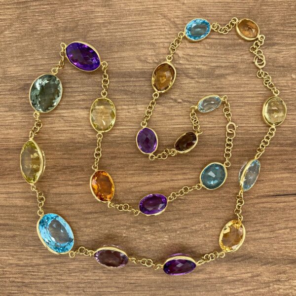 Gold chain with colorful gemstone beads.