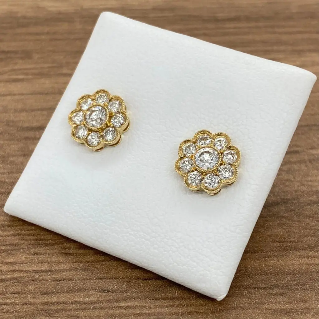 Diamond flower gold stud earrings.