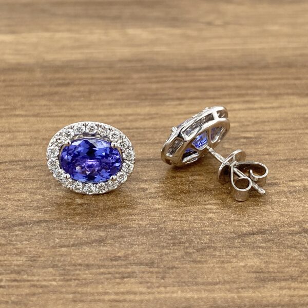 Oval sapphire and diamond earrings.