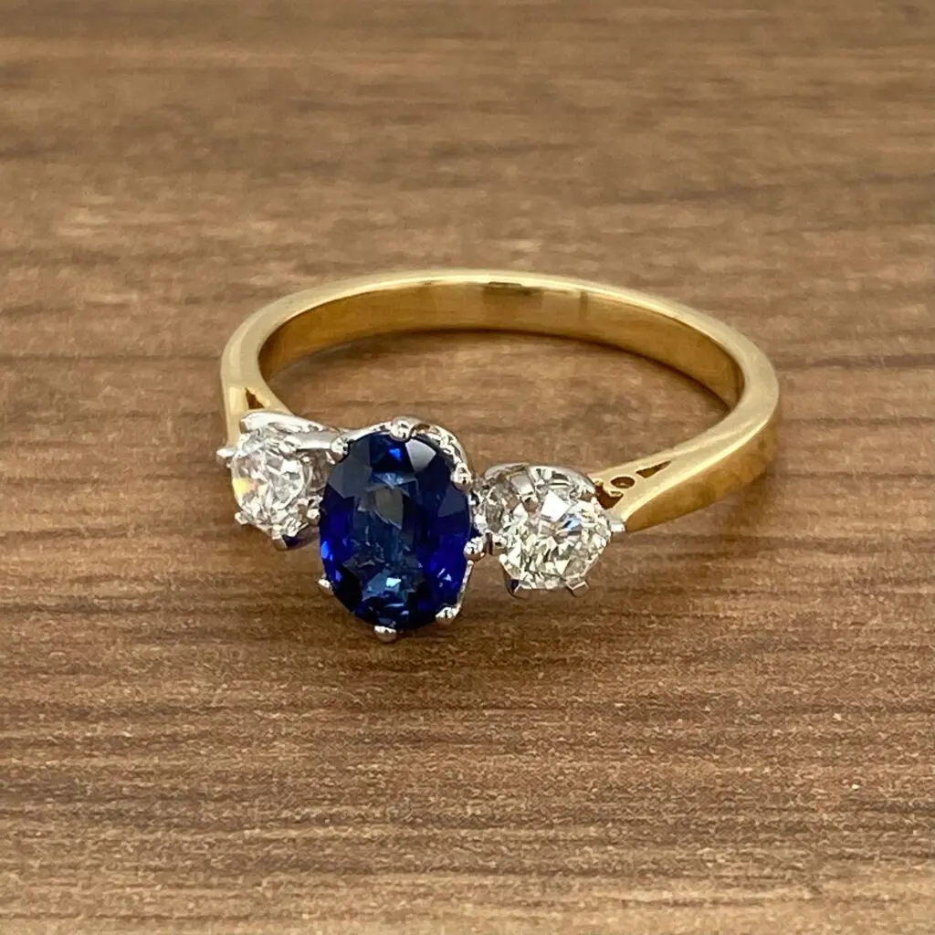 Gold ring with sapphire and diamonds.