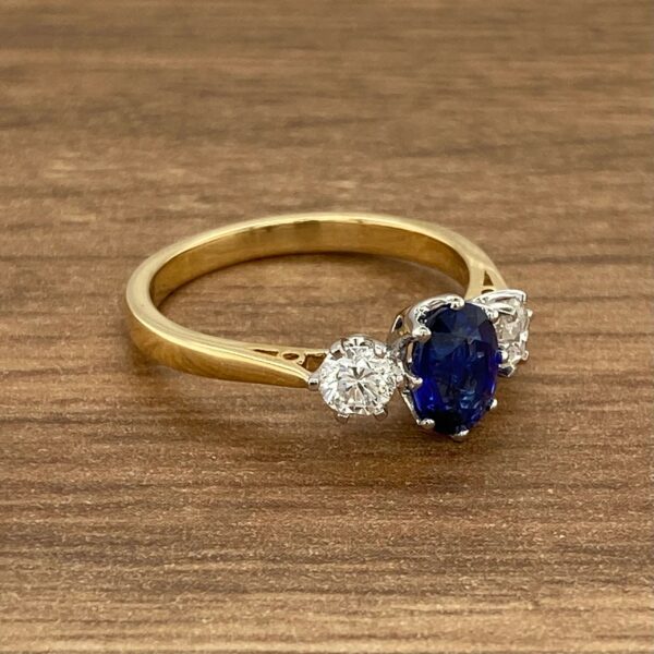 Gold ring with sapphire and diamond stones.