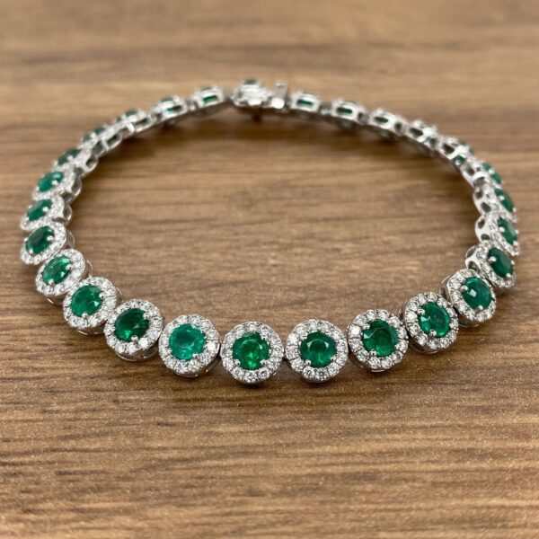 An Emerald & Diamond Halo Cluster Bracelet.