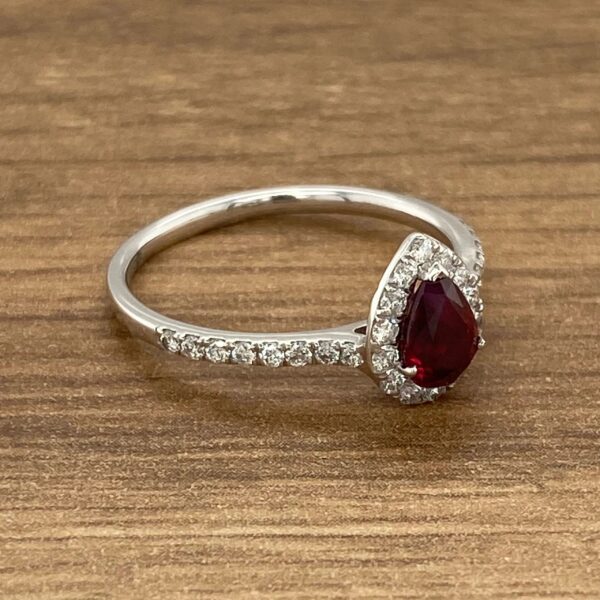 Diamond ring with pear-shaped ruby stone.