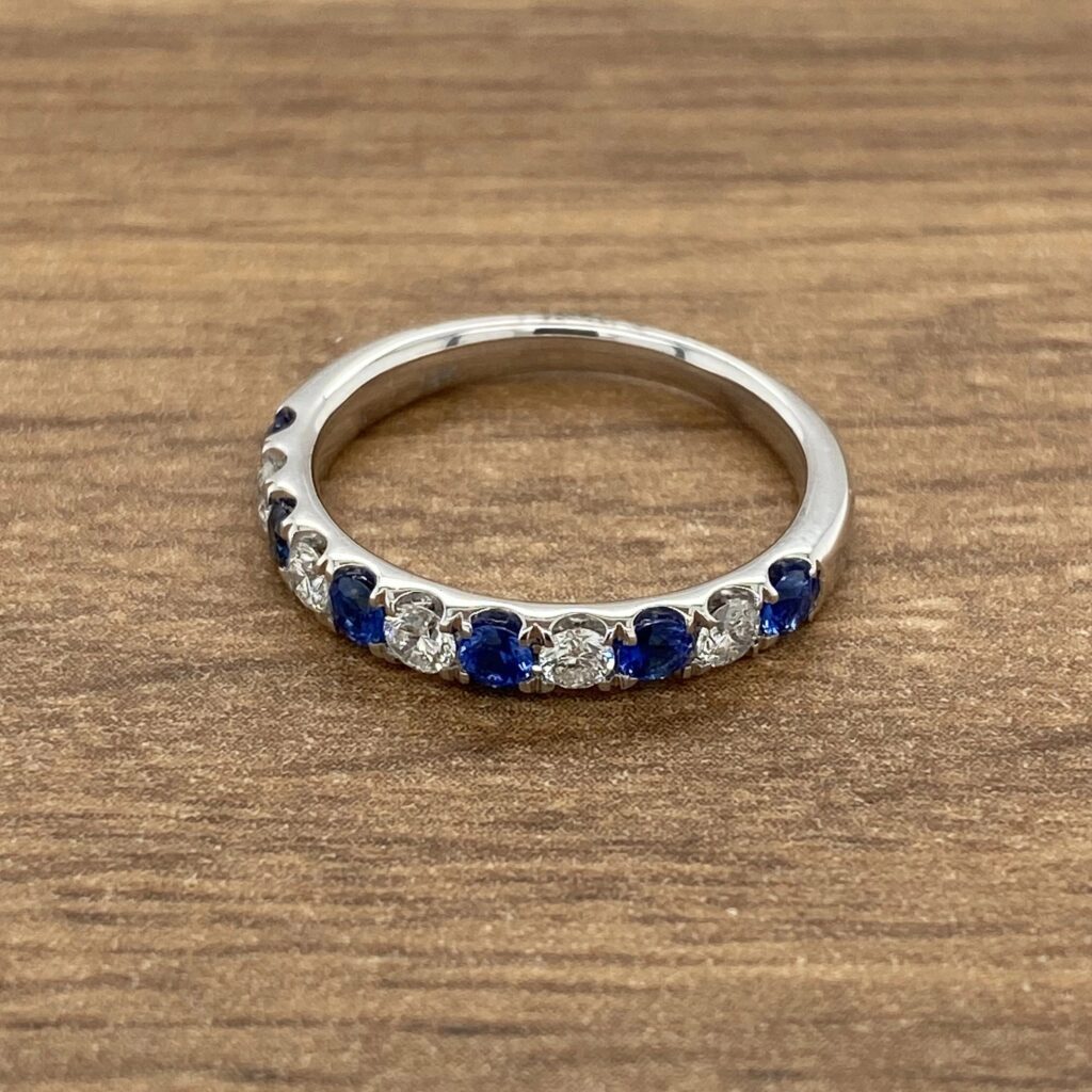 White gold ring with sapphires and diamonds.