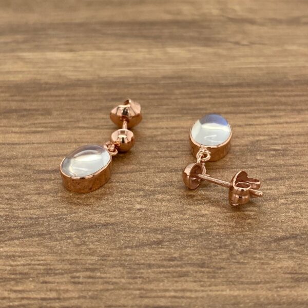 Rose gold earrings with moonstone drops.