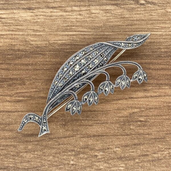 Silver marcasite lily of the valley brooch.