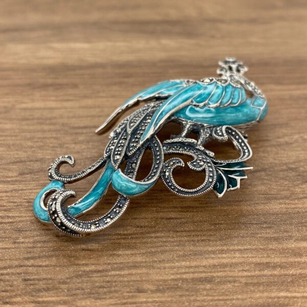 Silver and blue bird brooch with marcasite.