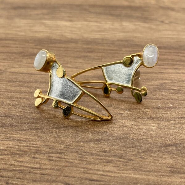 Gold and silver earrings with moonstone.