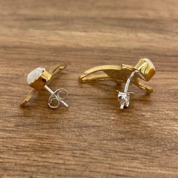 Gold earrings with white moonstone gems.