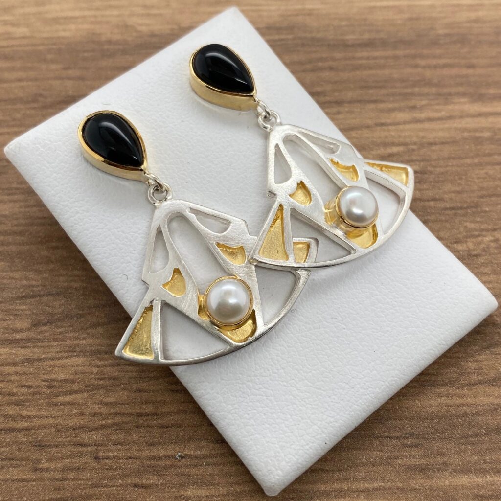 Silver earrings with black and white stones.