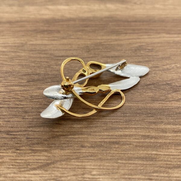 Gold and silver abstract brooch pin.