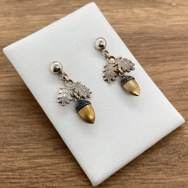 Silver acorn earrings with oak leaves.