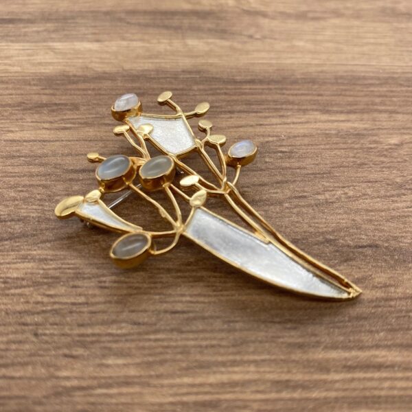 Gold and silver brooch with moonstones.