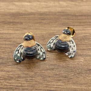 Gold and silver bee stud earrings.