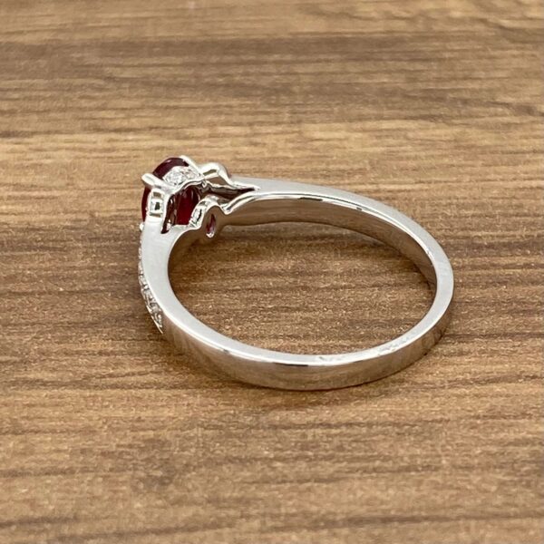 Side view of a red gemstone ring.