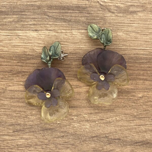 Purple and yellow flower earrings.