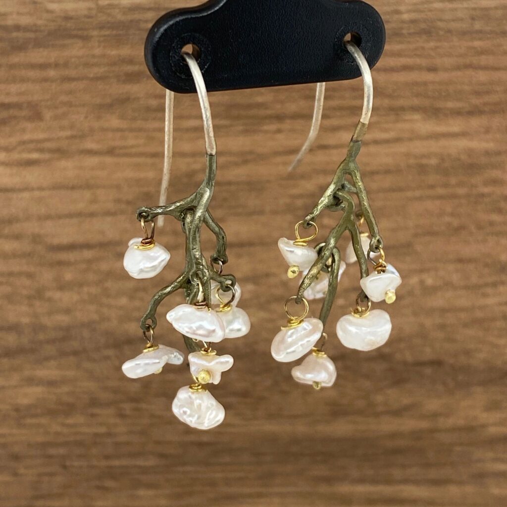 Pearl and branch dangle earrings.