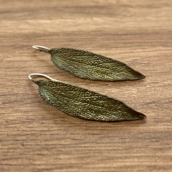 Two sage leaf shaped earrings.