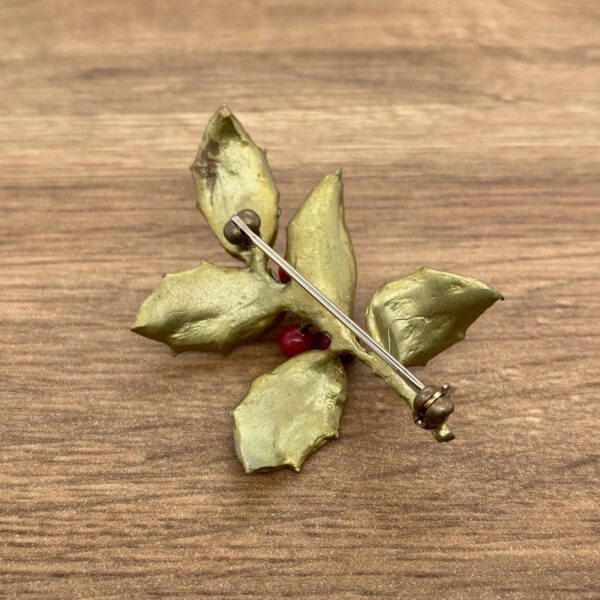 Gold and red holly leaf brooch