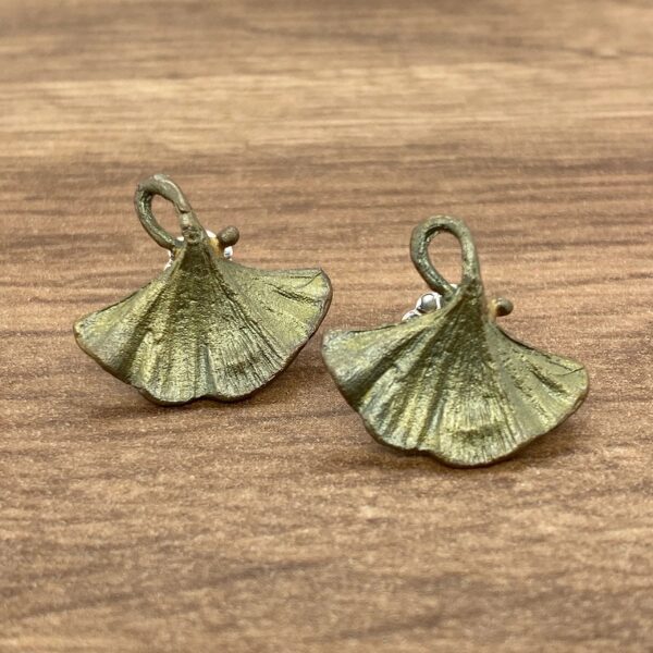 Pair of green ginkgo leaf earrings.