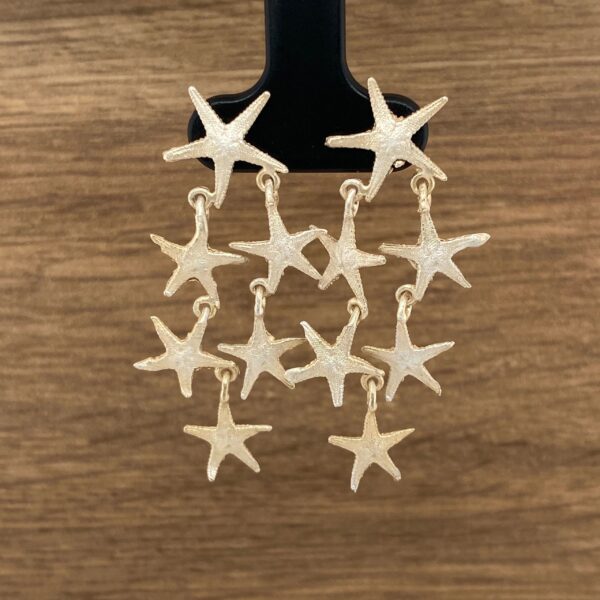 Gold starfish dangle earrings