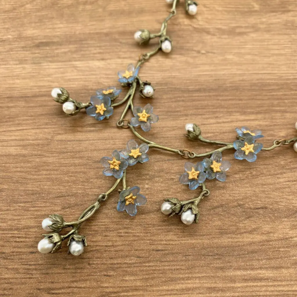 Forget-me-not flower and pearl necklace.