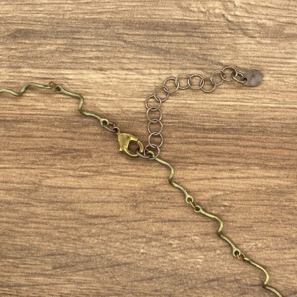 Gold chain necklace with clasp.