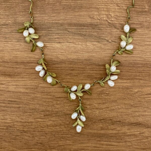 Gold leaf necklace with pearl accents.