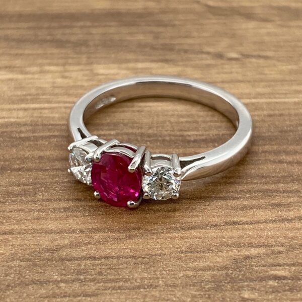 Three stone ring with ruby and diamonds.