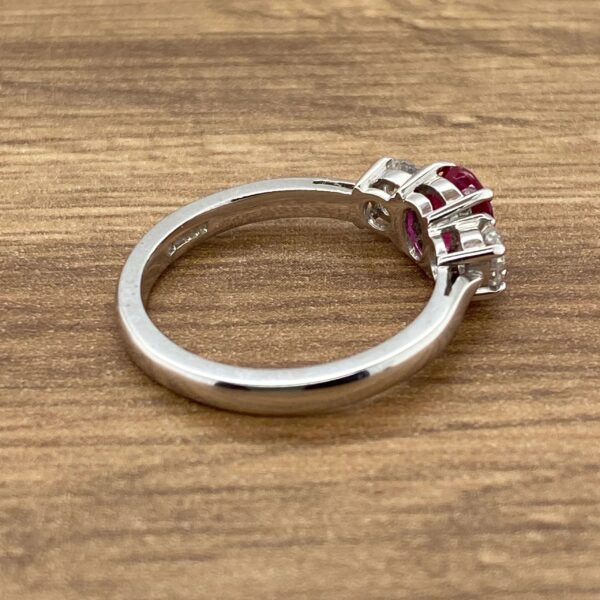 Silver ring with ruby and diamond stones.