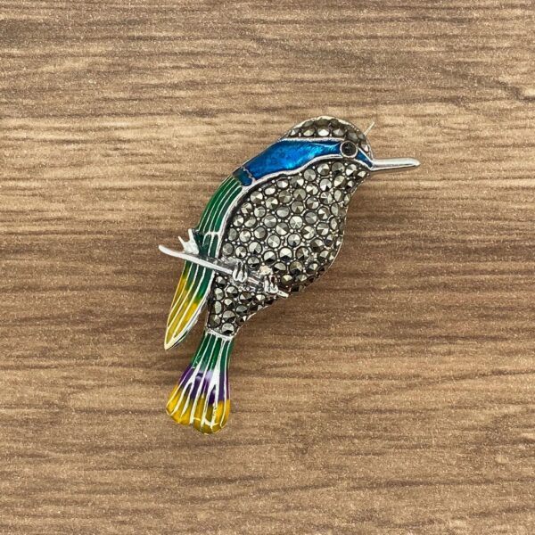 Silver bird brooch with colorful enamel.