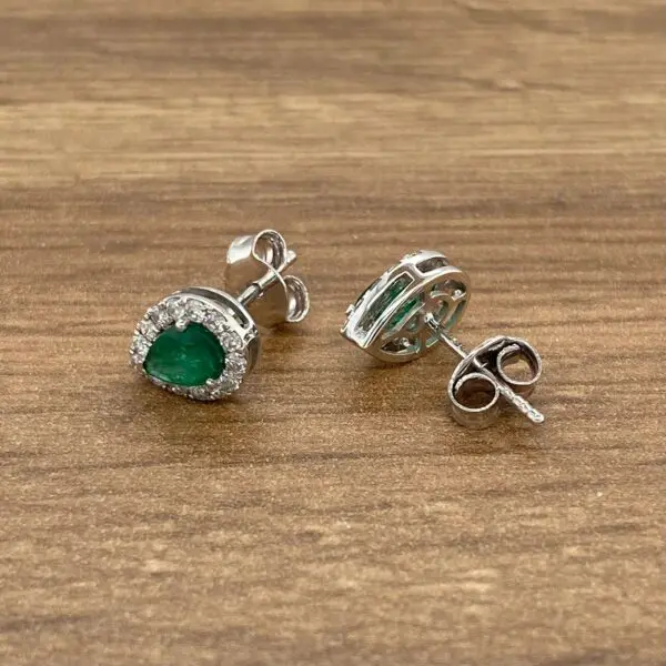 Emerald and diamond stud earrings.