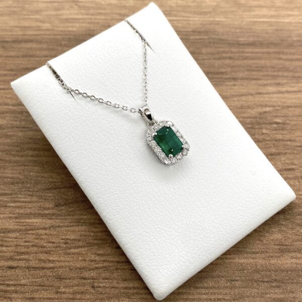 Emerald and diamond pendant necklace.