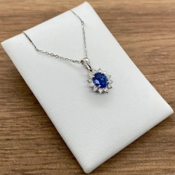 Diamond and sapphire pendant necklace.