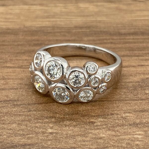 Diamond ring with bezel set stones.