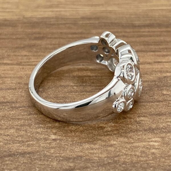 Silver ring with round diamonds.